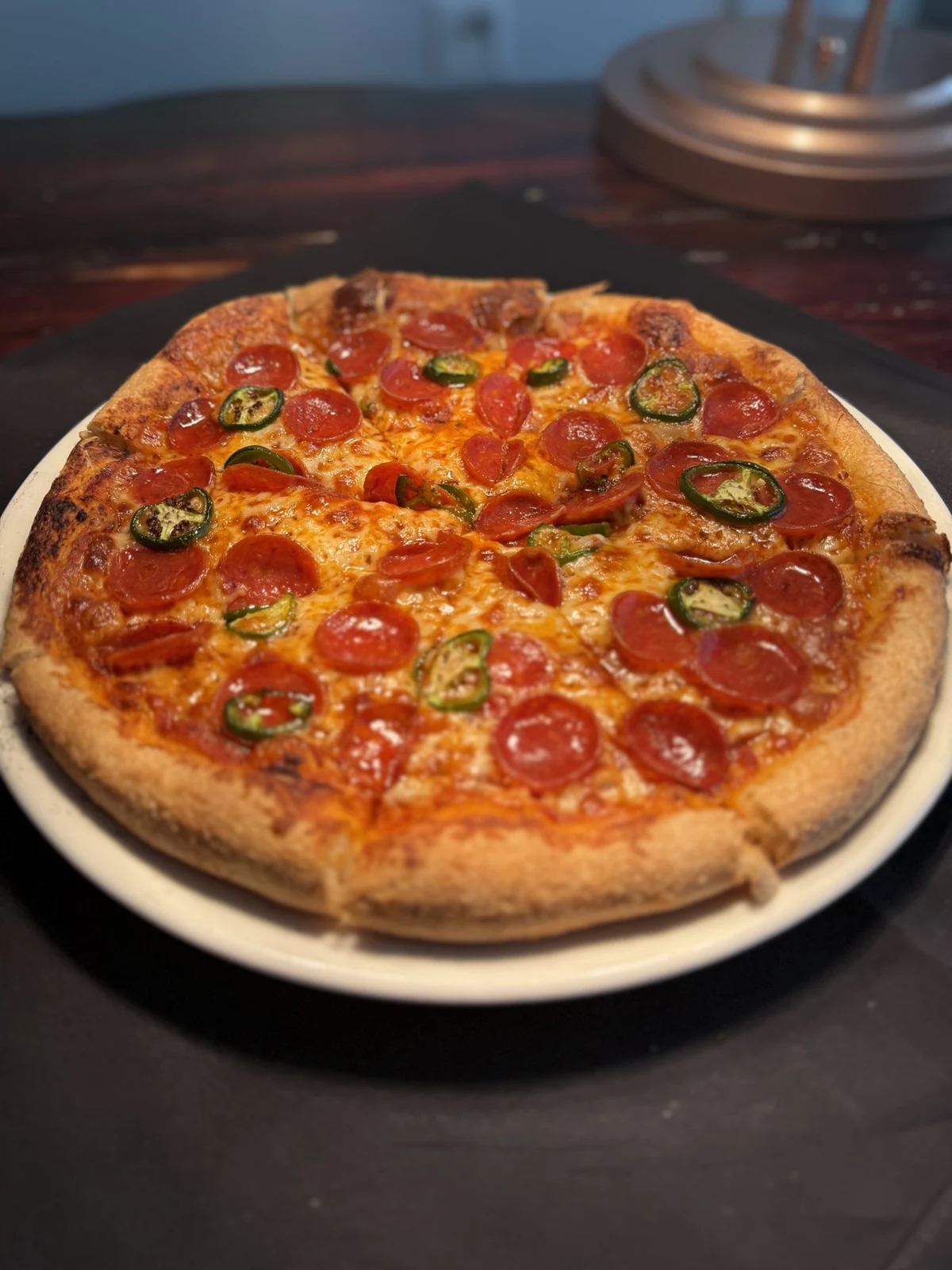 SPBH pizza topped with pepperoni and jalapeños