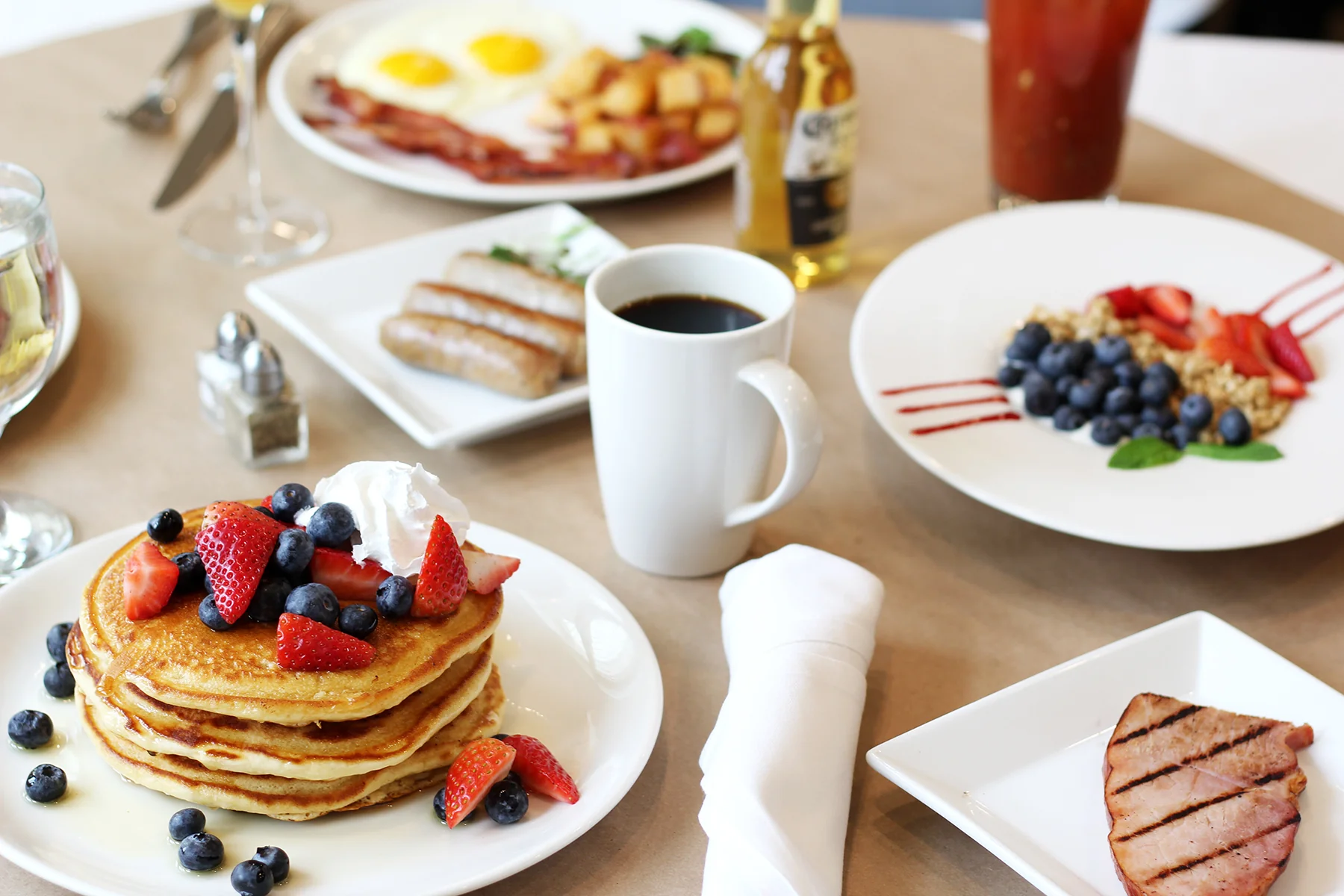 A full SPBH brunch spread with eggs, breakfast plates and drinks